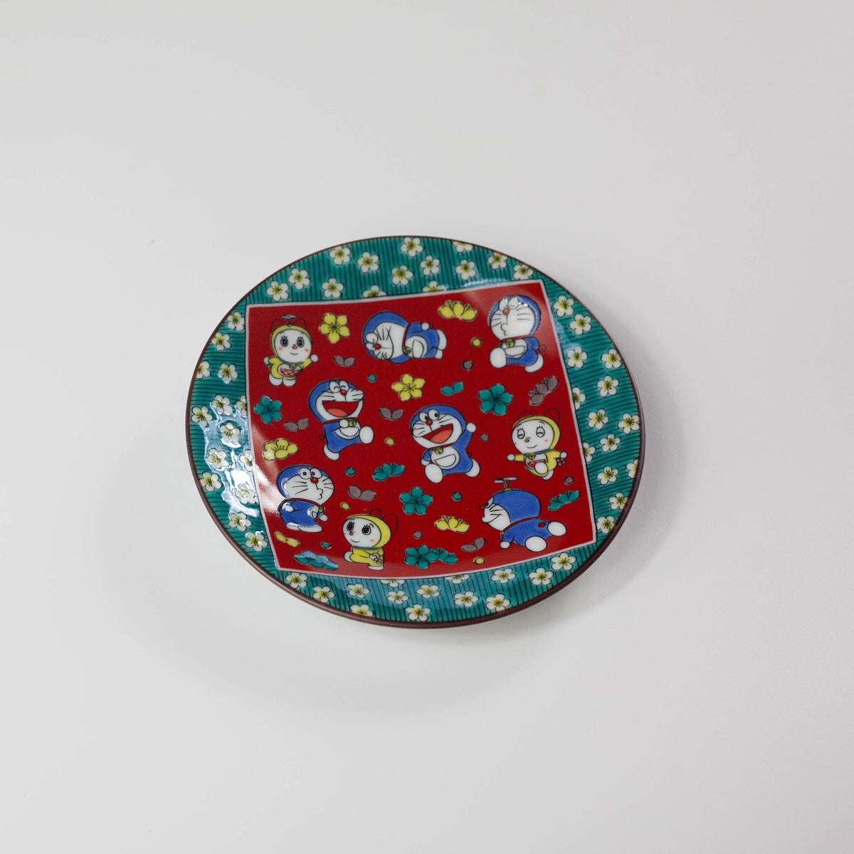 Decorative plate with Doraemon and Dorami character design on a white background