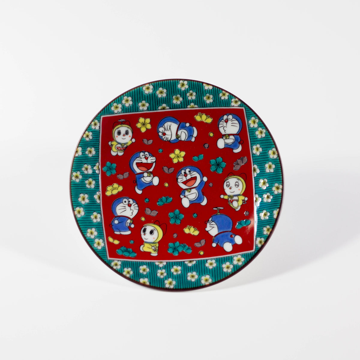 Decorative plate with Doraemon design on a white background