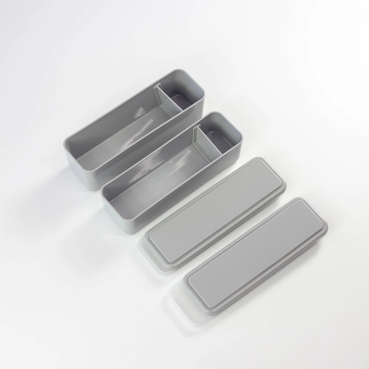 Gel-Cool Square Slim Bento Box 700ml in grey, open and disassembled showing two rectangular inner containers with dividers and two flat lids placed separately, on white background
