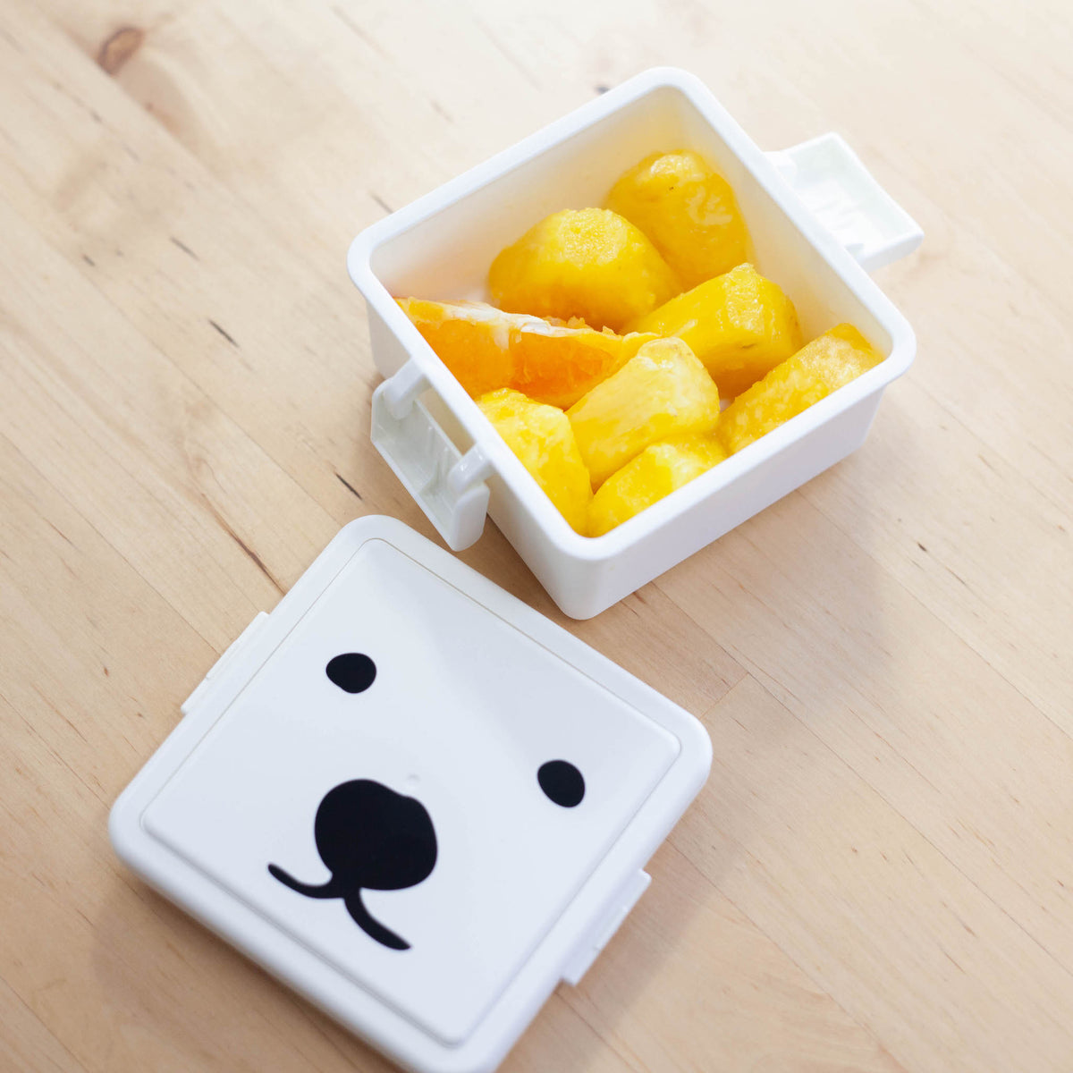 GEL-COOma Bento Box Small open with fresh pineapple chunks on light wood surface