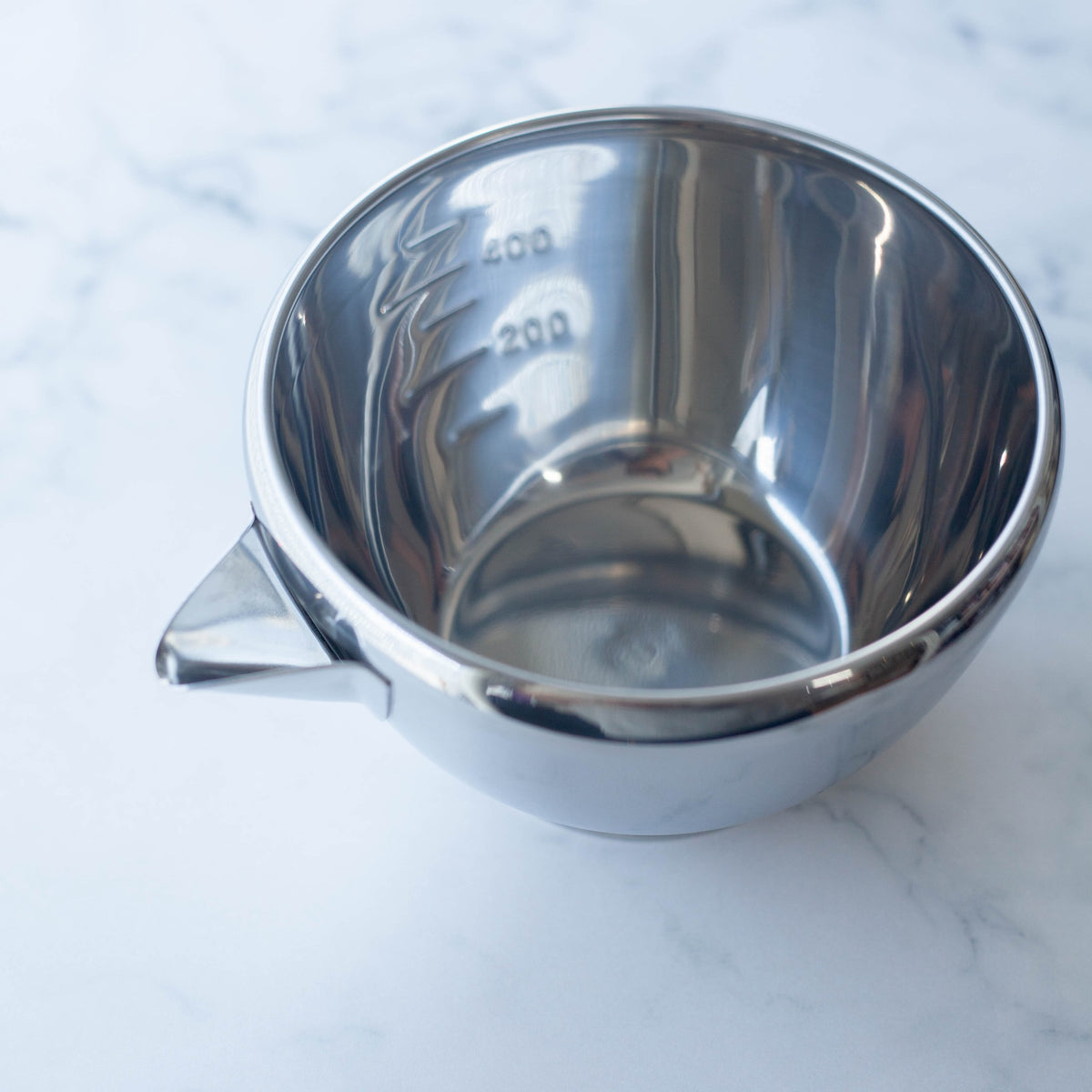 Katakuchi Mixing Bowl 700mL – polished stainless steel with pouring spout, white background