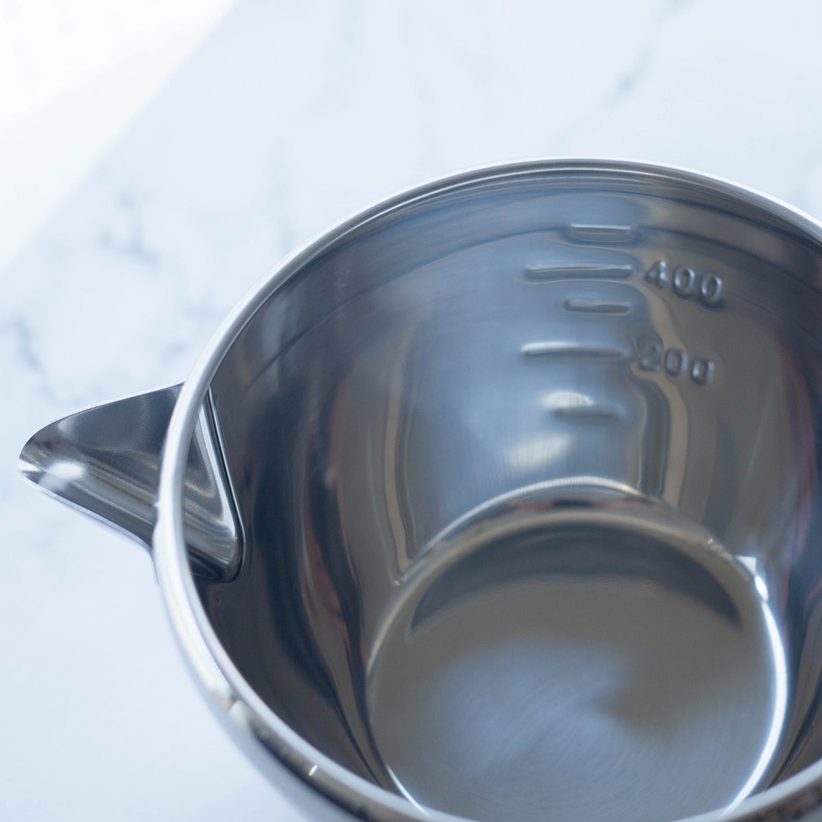 Katakuchi Mixing Bowl 700mL – polished stainless steel with pouring spout, white background