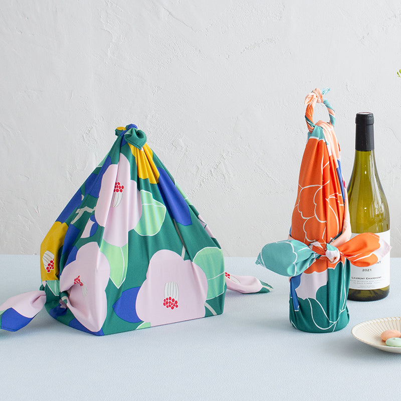 Aquadrop Furoshiki 70cm Tsubaki Green – Japanese wrapping cloth with bold pink and yellow camellia flowers and blue and green leaves on dark teal background, made in Japan