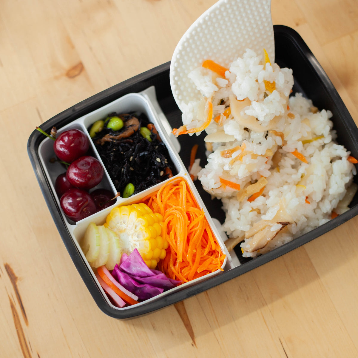 Shikiri Bento Box filled with a meal in each compartment
