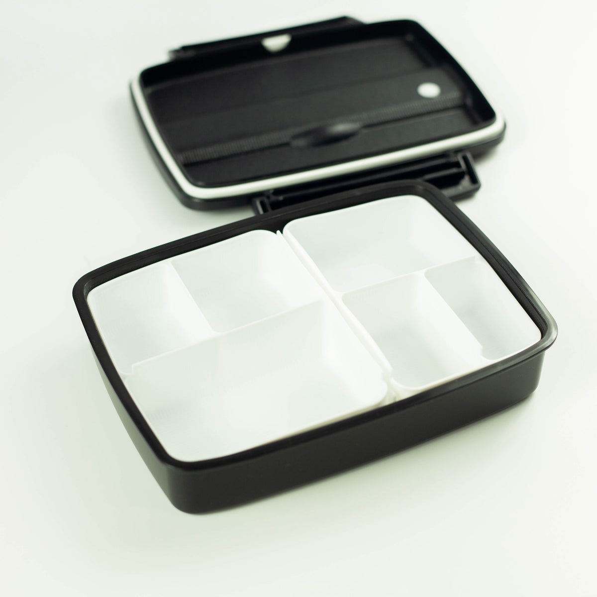 Shikiri Bento Box filled with a meal in each compartment
