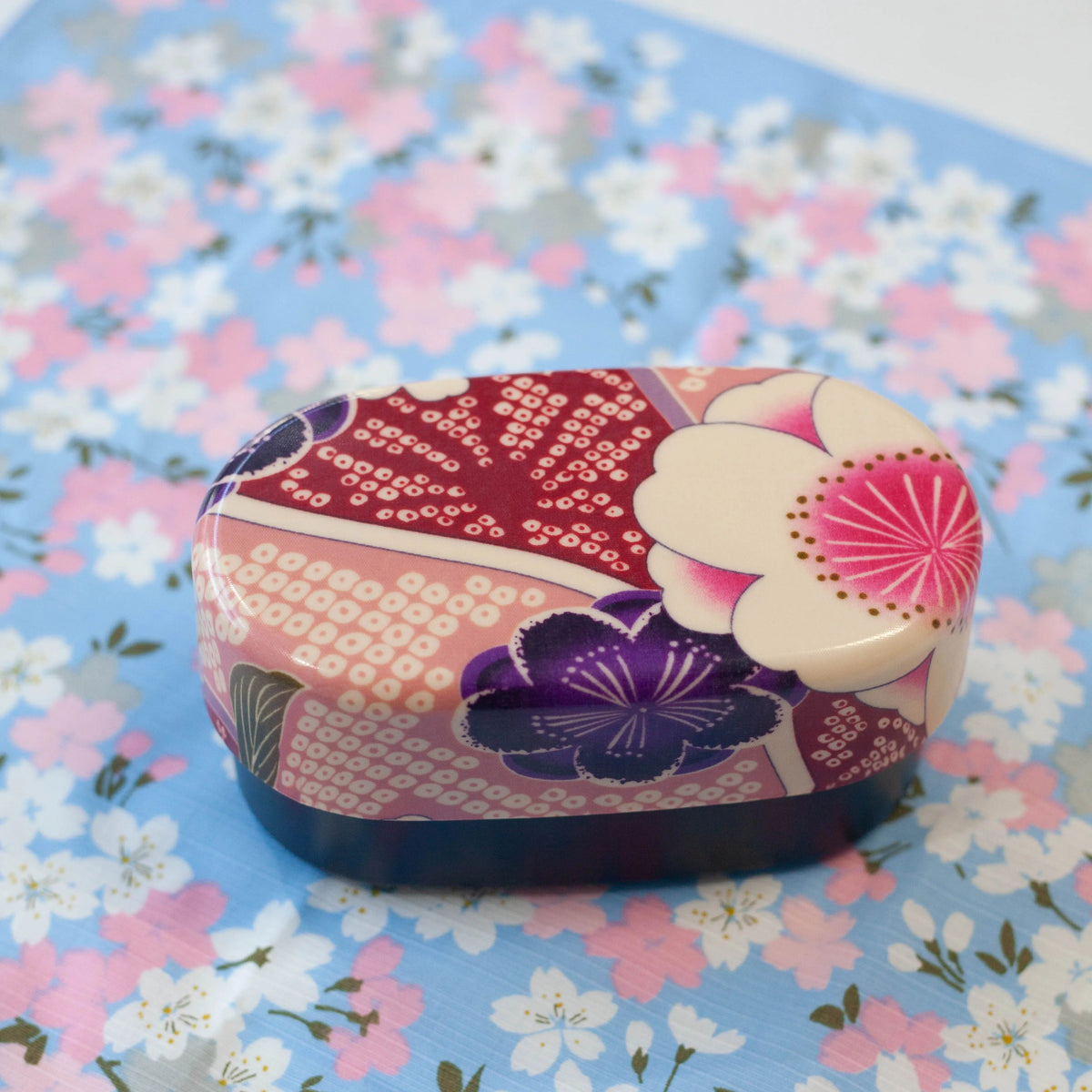 Kimono Sakura Pink Bento Box styled on blue sakura blossom background – Bento&co