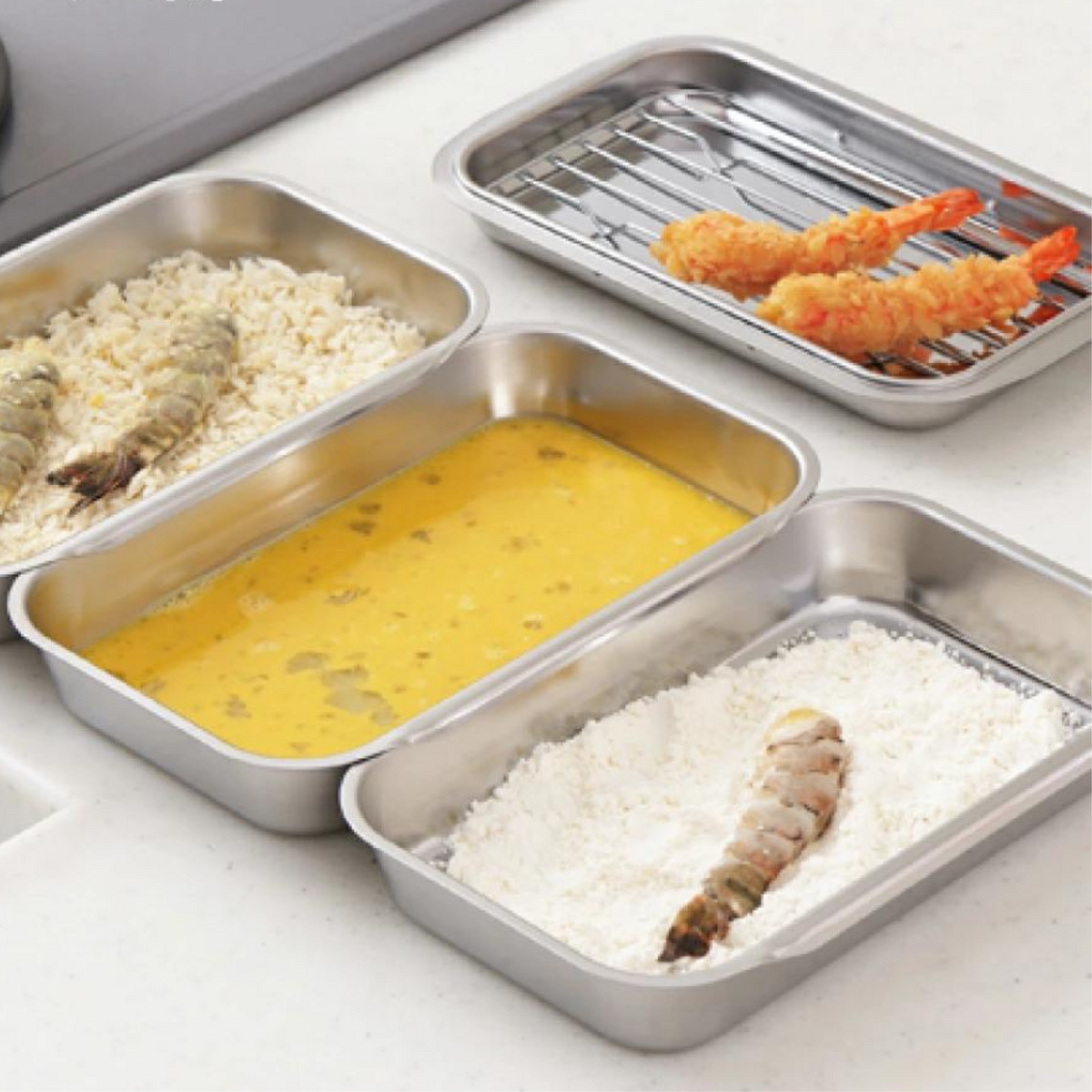 Compact Vat Set in use – four stainless steel trays holding tempura, beaten egg, and rice during cooking preparation