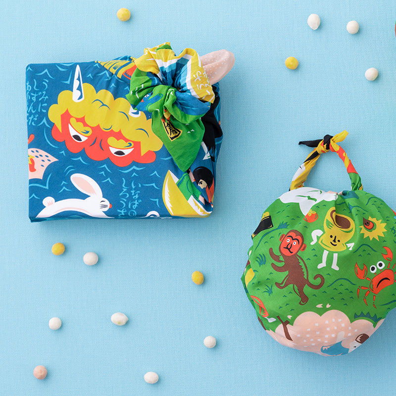 Gift box wrapped in Cochae Musubi Sea Edition Furoshiki, playful blue Japanese sea folklore organic cotton wrap