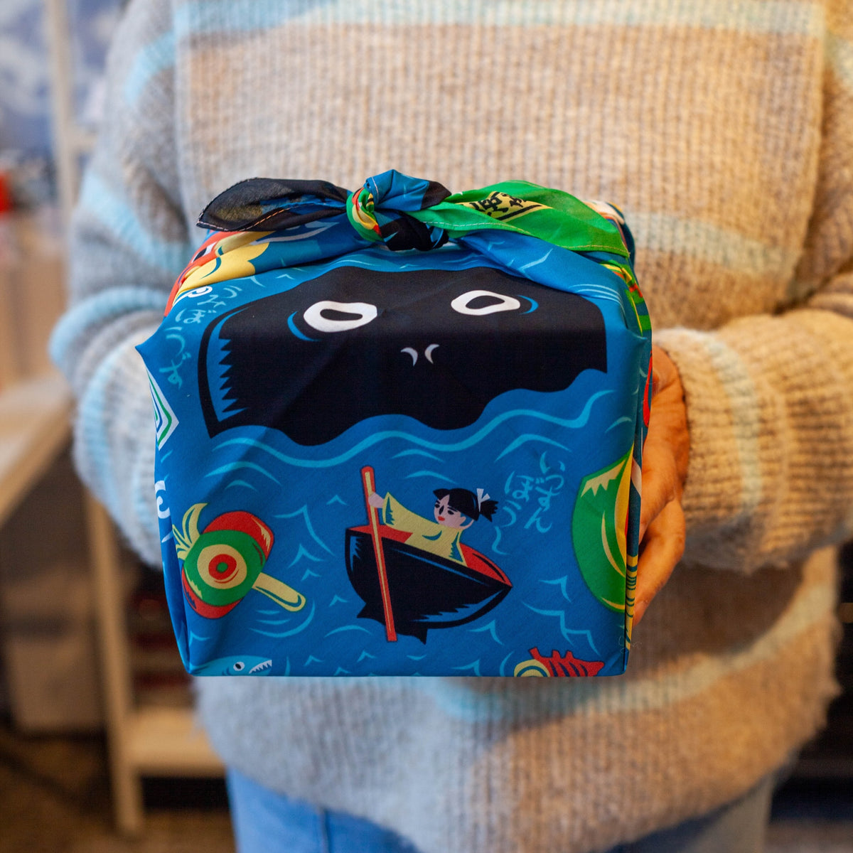 Bento box wrapped in Cochae Musubi Sea Edition Furoshiki, playful blue Japanese sea folklore organic cotton wrap