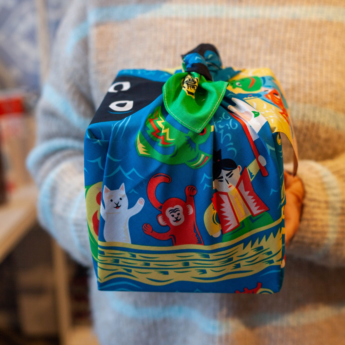 Bento box wrapped in Cochae Musubi Sea Edition Furoshiki, playful blue Japanese sea folklore organic cotton wrap