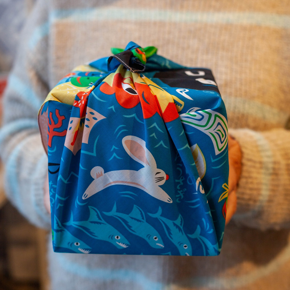 Bento box wrapped in Cochae Musubi Sea Edition Furoshiki, playful blue Japanese sea folklore organic cotton wrap