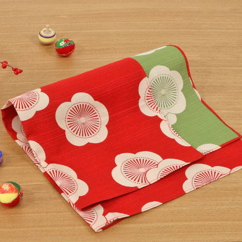 Isa Monyo Reversible Furoshiki 48cm Ume Red Green – double-sided Japanese wrapping cloth with large white plum blossom pattern, red on one side and green on the other, 100% cotton, made in Japan