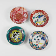 Four decorative plates with colorful Captain Tsubasa designs on a white background