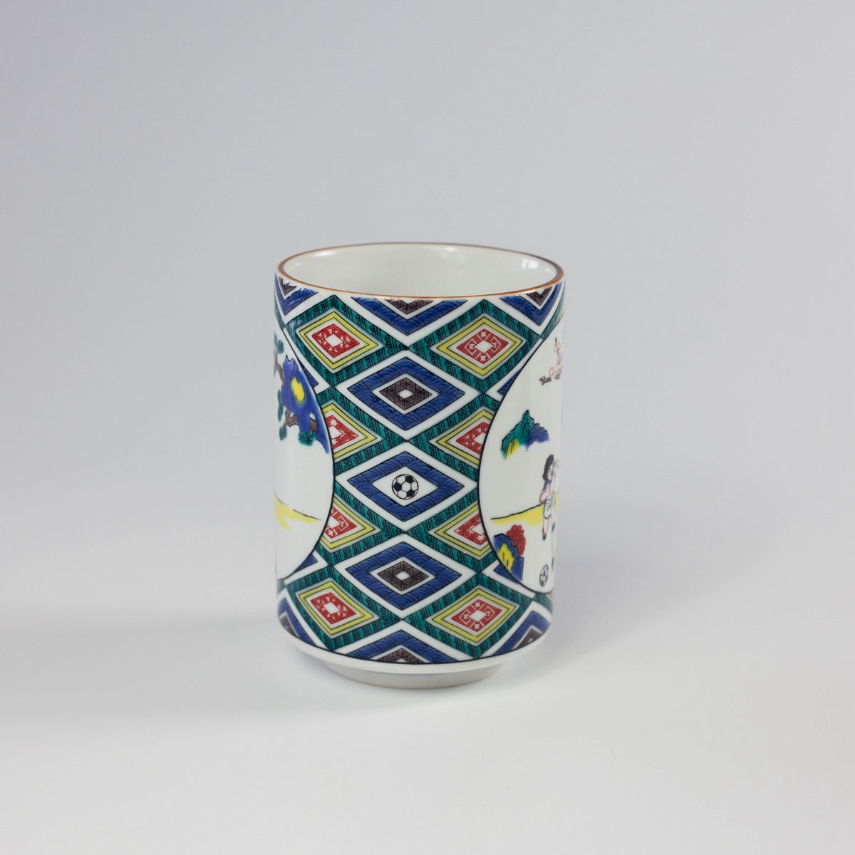 Ceramic mug with geometric pattern on a white background