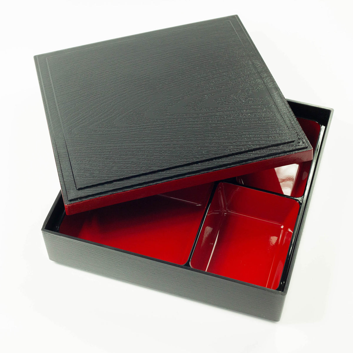Japanese lacquerware-style bento box with black wood-grain textured lid and dark red base, elegant square lunch box, made in Japan