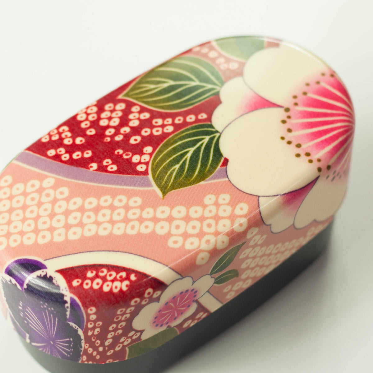 Kimono Sakura Pink Bento Box with red elastic band, overhead angled view – Bento&co