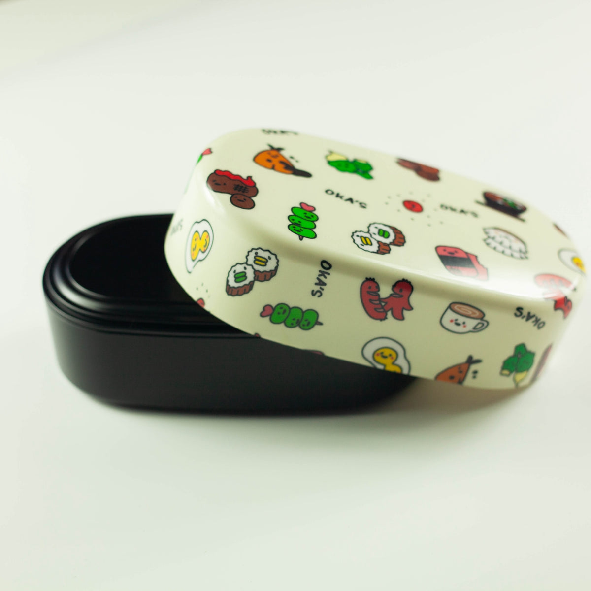 Oka's Oval Bento Box, 830ml, two-tier oval Japanese lunch box with a whimsical side-dish print