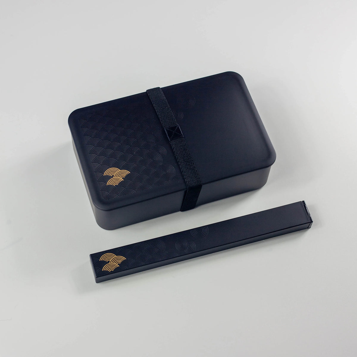 Wamon Bento Box 800mL black seigaiha closed with elastic band and matching chopstick case with chopsticks