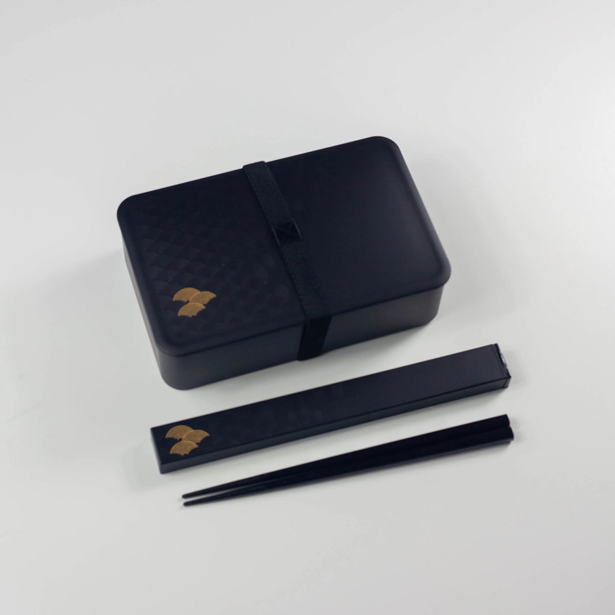 Wamon Bento Box 800mL black seigaiha closed with elastic band and matching chopstick case with chopsticks