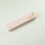 Sakura Cutlery Set pink case closed, angled view showing cherry blossom branch design on soft pink background