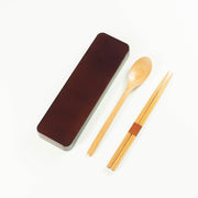 Dark brown wooden cutlery set with chopsticks, spoon and sliding case