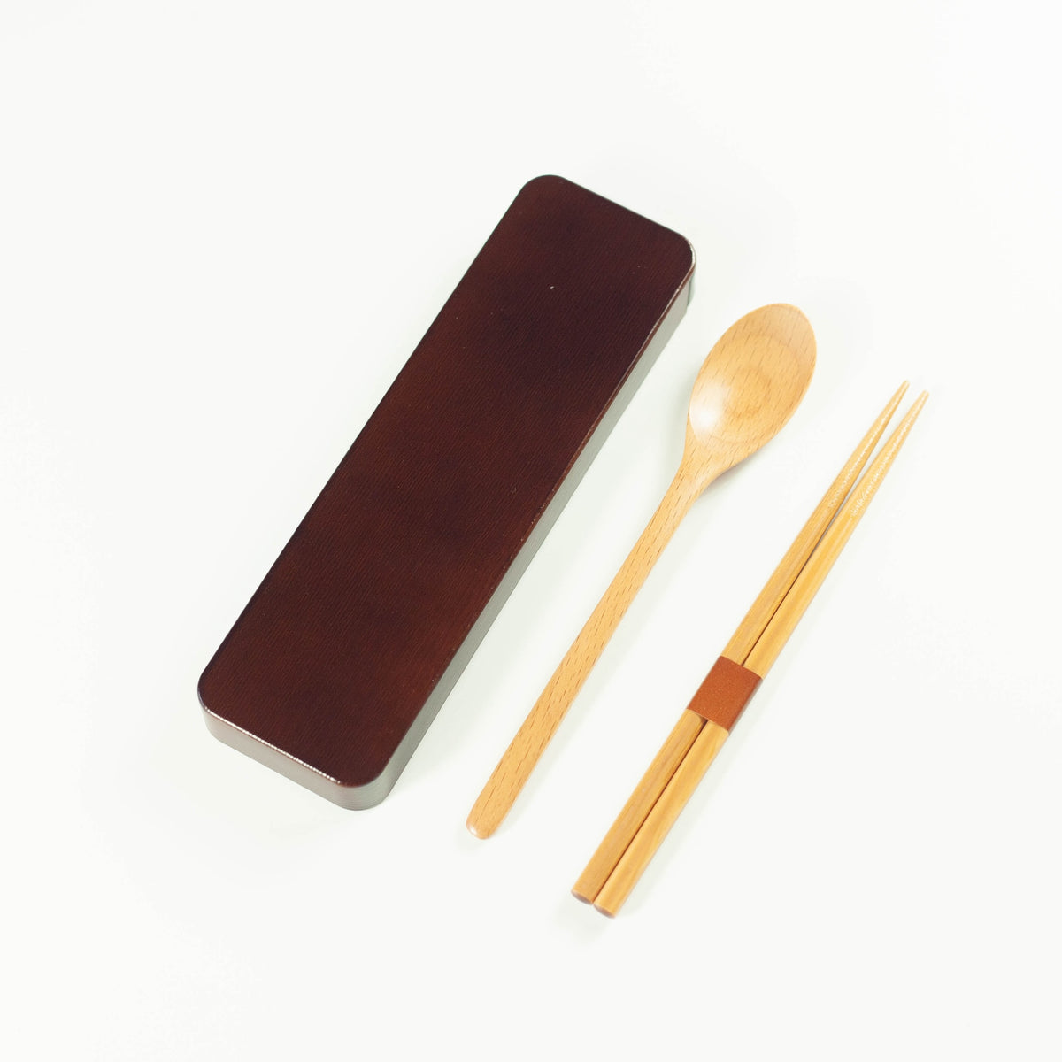 Dark brown wooden cutlery set with chopsticks, spoon and sliding case