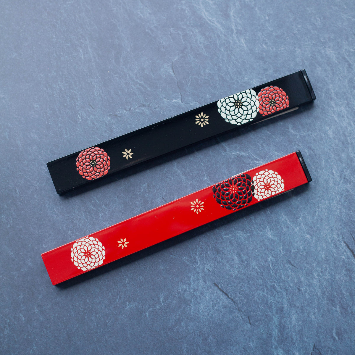 Ojyu Chopsticks Set with wooden chopsticks and slide-style case, available in red and black
