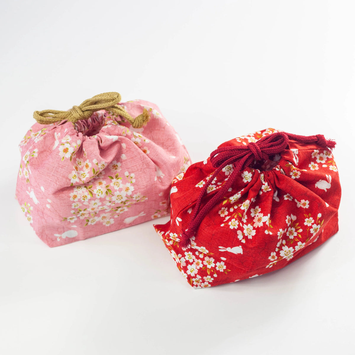 Sakura Usagi Bento Bag in Pink and Red with a cherry blossom and rabbit pattern