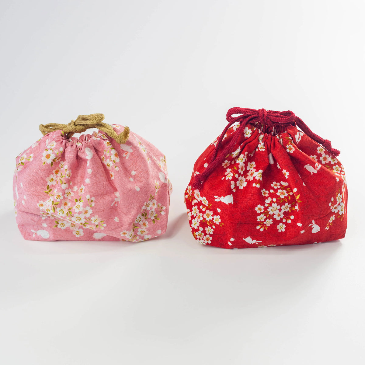Sakura Usagi Bento Bag in Pink and Red with a cherry blossom and rabbit pattern