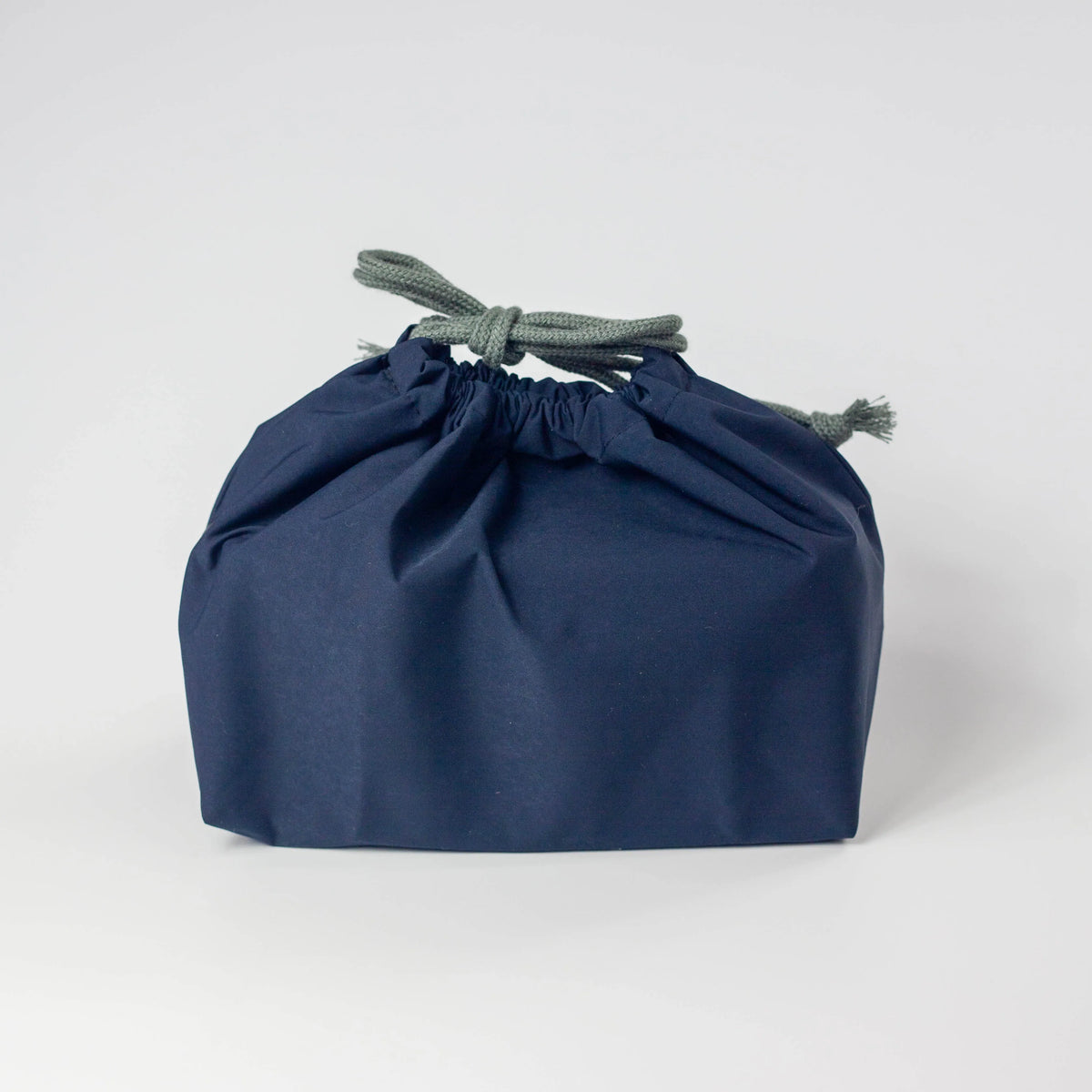 Water Repellent Drawstring Bag in navy blue with grey drawstring cord, closed, front view on white background