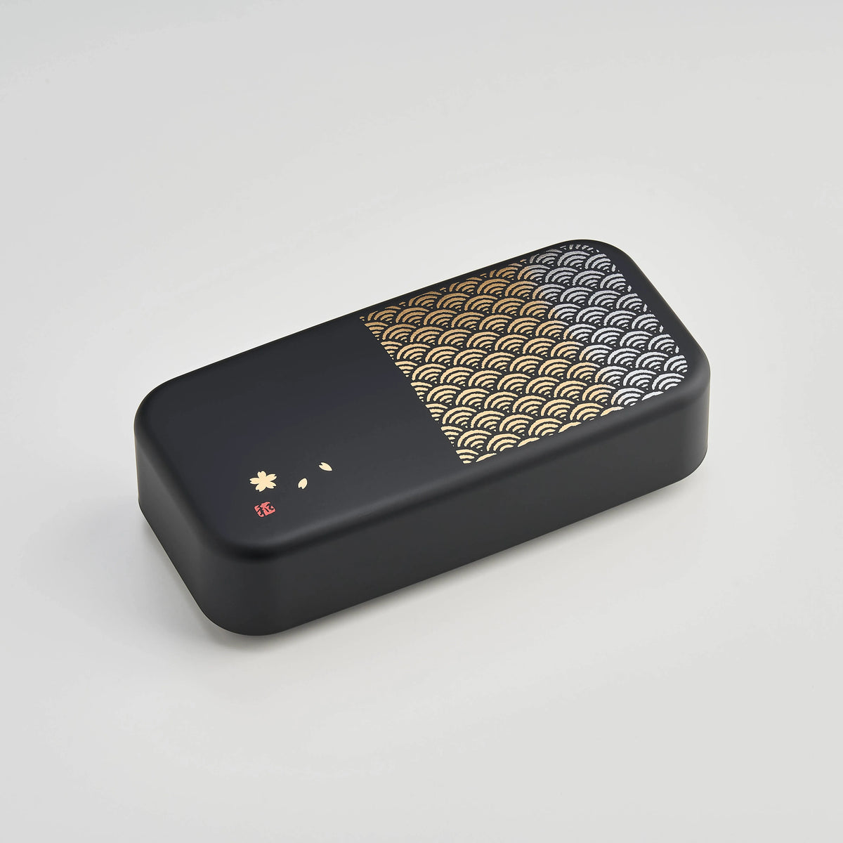 Nami Bento Box, matte-black two-tier bento box with traditional Japanese seigaiha wave pattern in muted gold, 950ml, made in Japan