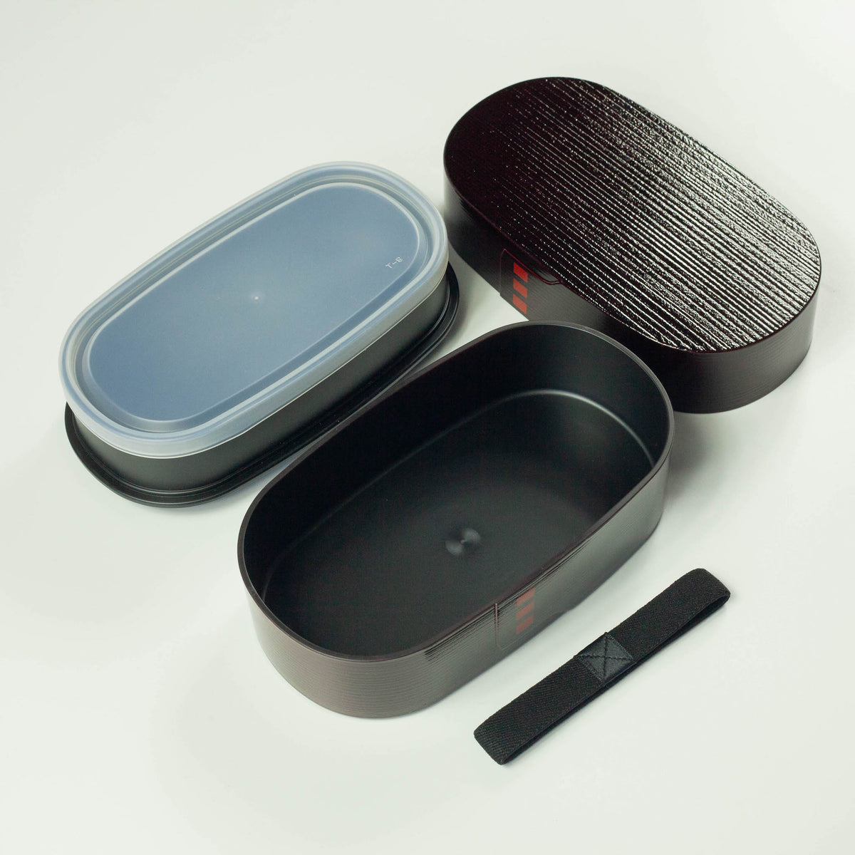 Nuri Wappa Bento Box in Dark Wood, Red Wood, and Light Wood