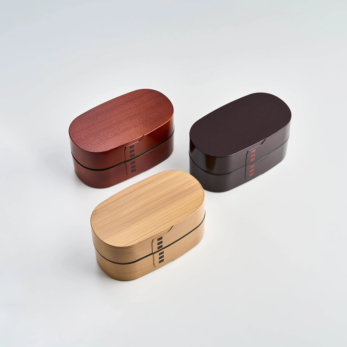 Nuri Wappa Bento Box in Dark Wood, Red Wood, and Light Wood with a traditional Japanese design