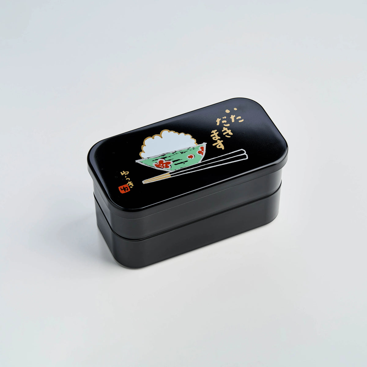 Itadakimasu two-tier bento box with rice bowl and chopsticks illustration
