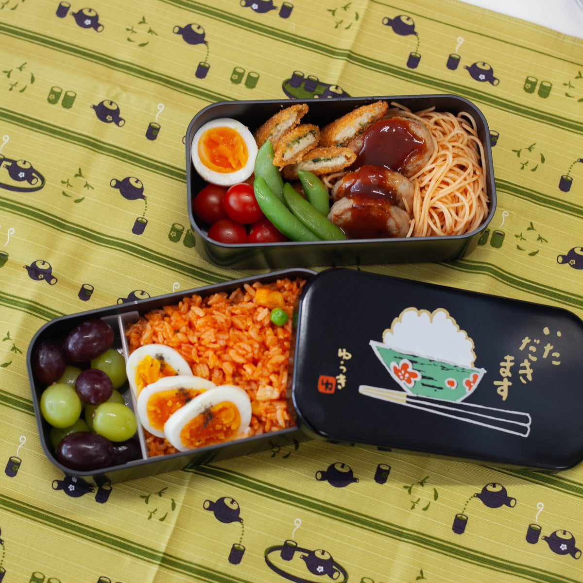 Itadakimasu two-tier bento box with rice bowl and chopsticks illustration