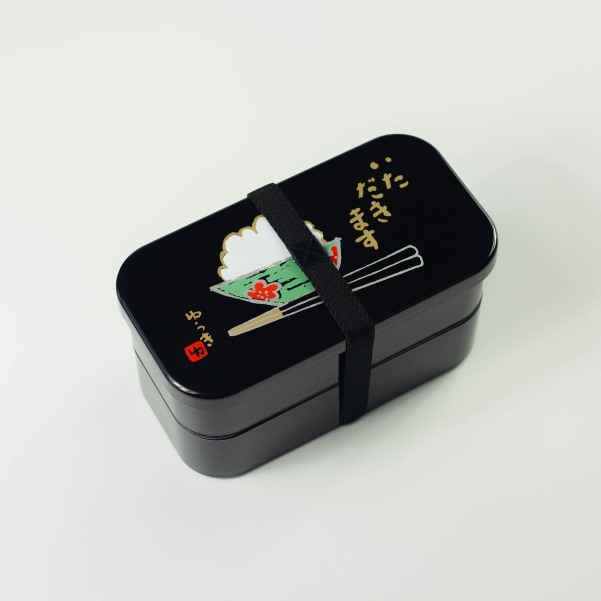 Itadakimasu two-tier bento box with rice bowl and chopsticks illustration