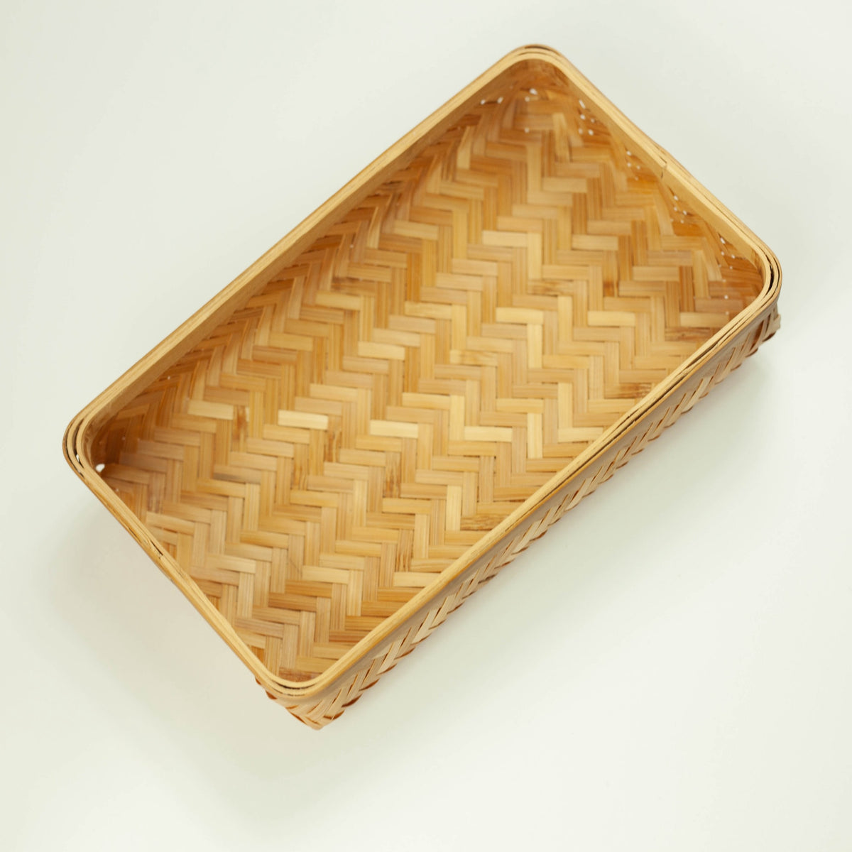 Woven Bamboo Bento Box lid – top view showing honey-brown herringbone weave pattern and natural bamboo texture