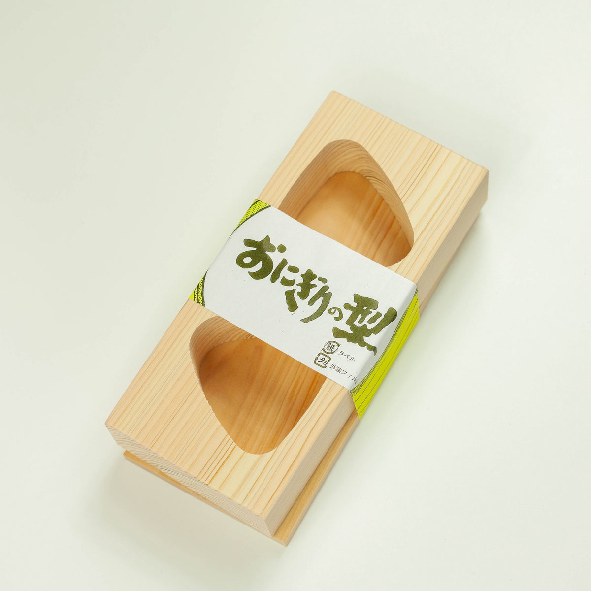Hinoki Onigiri Mold – Japanese cypress wood rice ball mold with two triangle-shaped cavities for making perfectly shaped onigiri, shown with freshly made rice balls, made in Japan