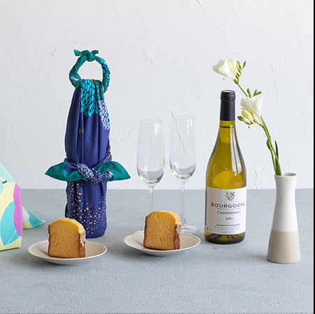 Wine bottle or gift wrapped in Hime Musubi Star Forest Furoshiki, navy starry night pattern organic cotton eco-friendly wrap
