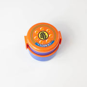 Dragon Ball round bento box in orange and blue with the Kame kanji emblem and seven Dragon Balls on the lid