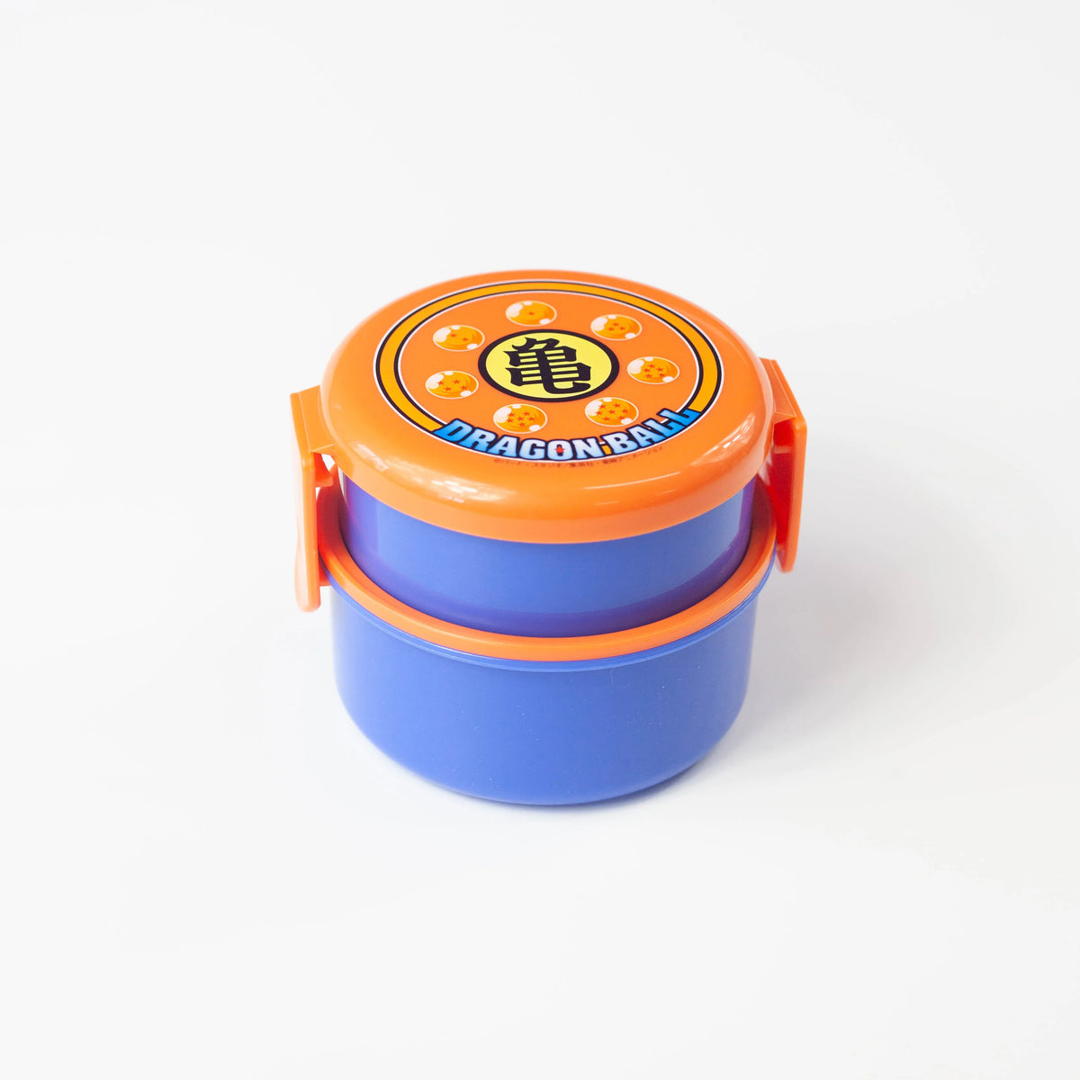 Dragon Ball two-tier round bento box with blue containers, an orange lid, and closed side clips