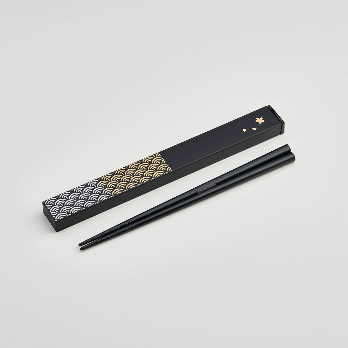 Nami Chopsticks Set with black slide-style case and gold wave pattern