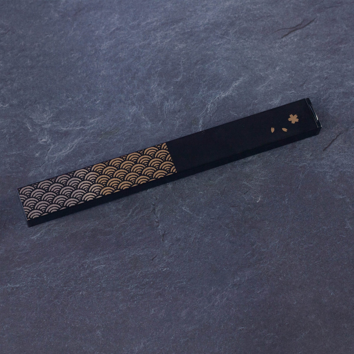 Nami Chopsticks Set with black slide-style case and gold wave pattern