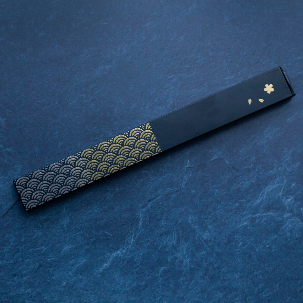 Nami Chopsticks Set with black slide-style case and gold wave pattern
