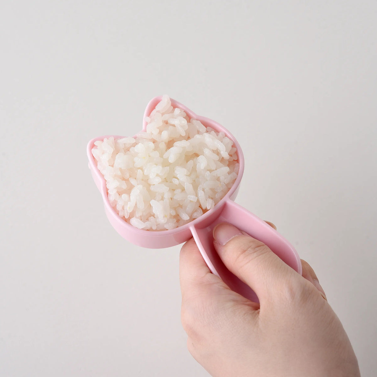 Step-by-step instructions for Neko Kao Onigiri Set – 4 steps showing how to mold rice, cut nori, and assemble cat face onigiri