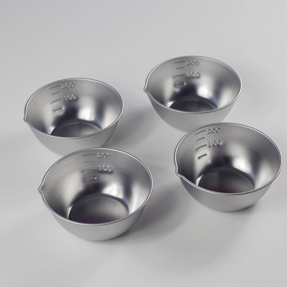 Set of 4 stainless steel mixing bowls with pouring spout and inner markings, made in Tsubame, Japan
