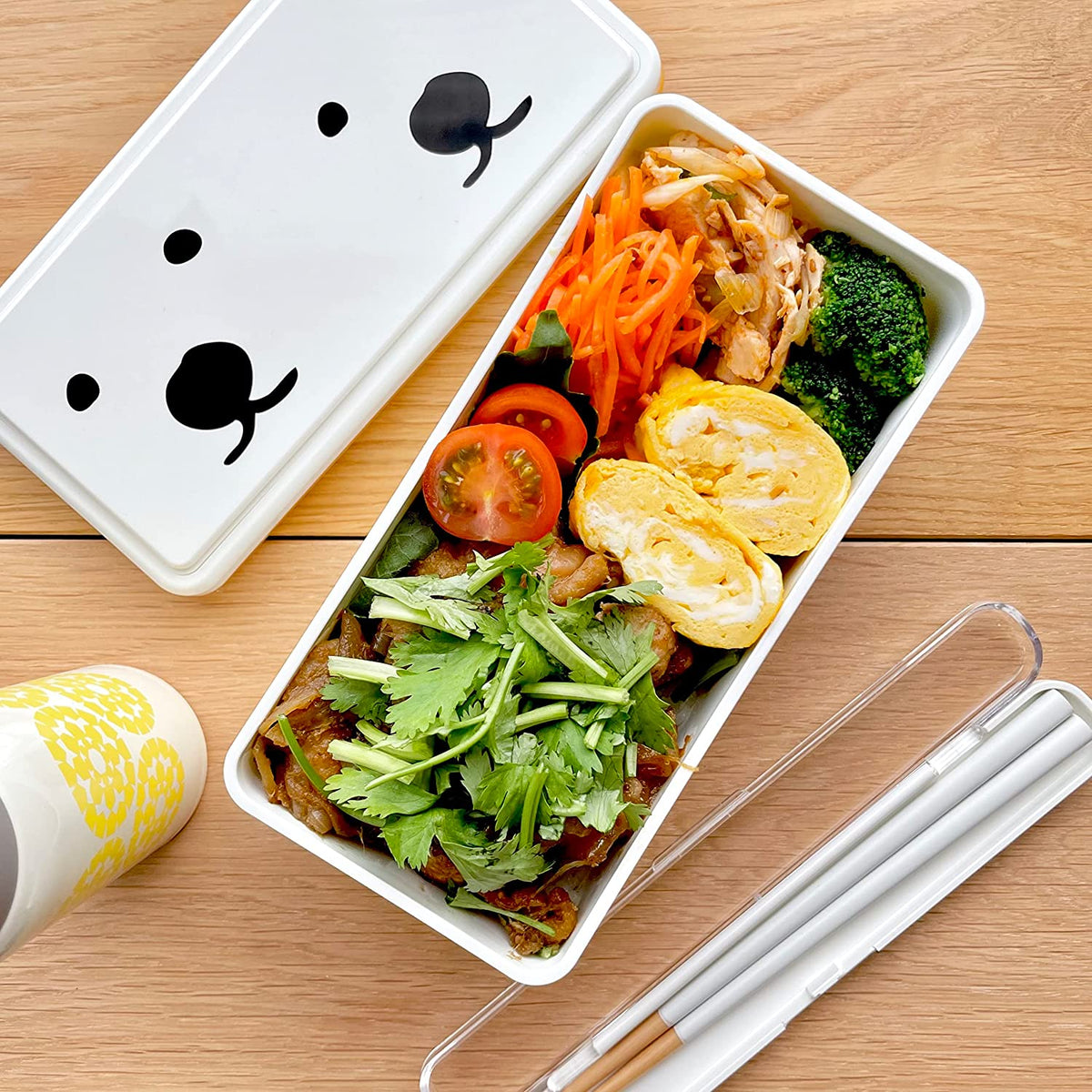 GEL-COOma Bento Box open with colorful Japanese lunch – carrots, broccoli, tomato, tamagoyaki