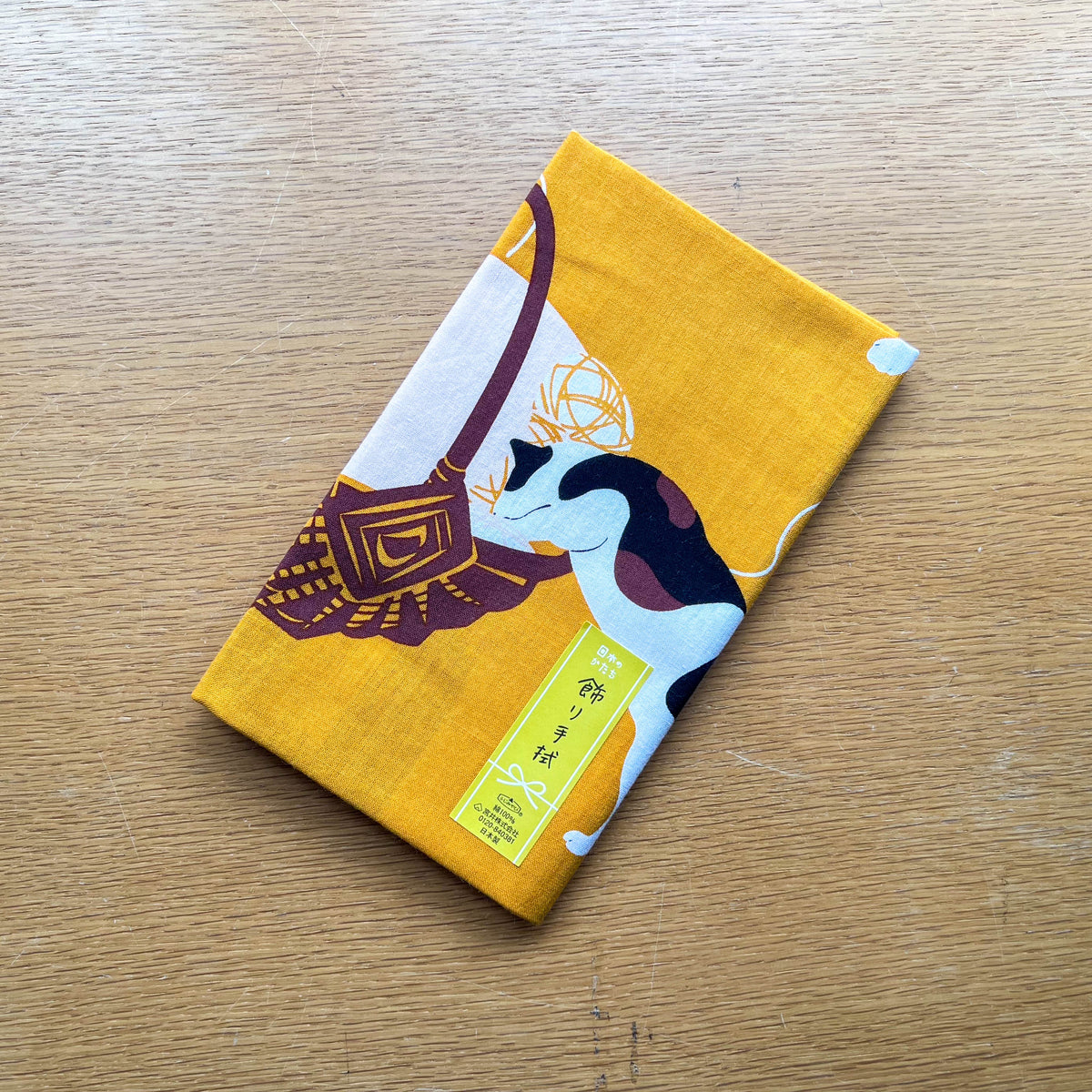 Kotatsu Neko tenugui cloth featuring cats relaxing in a Japanese living room