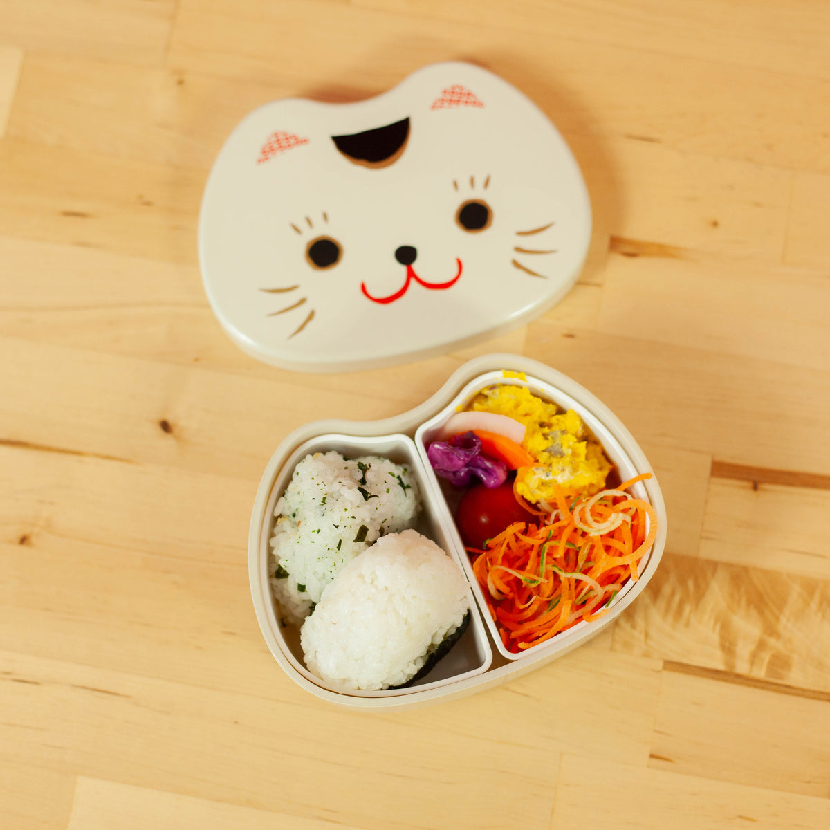 Kao Neko Bento Box with smiling cat face lid, available in white and black
