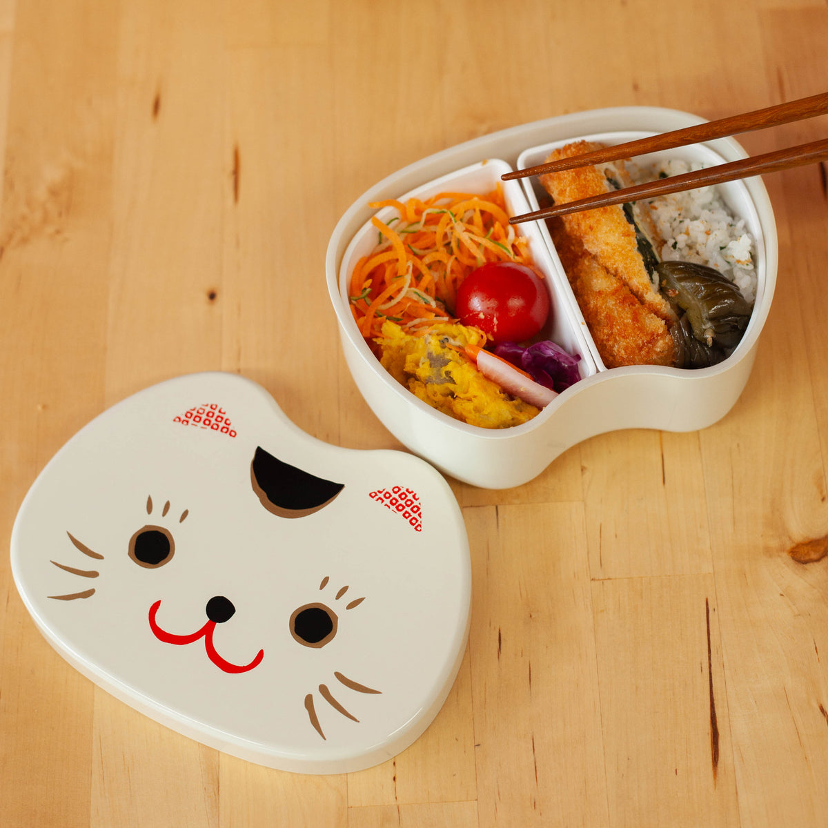 Kao Neko Bento Box with smiling cat face lid, available in white and black